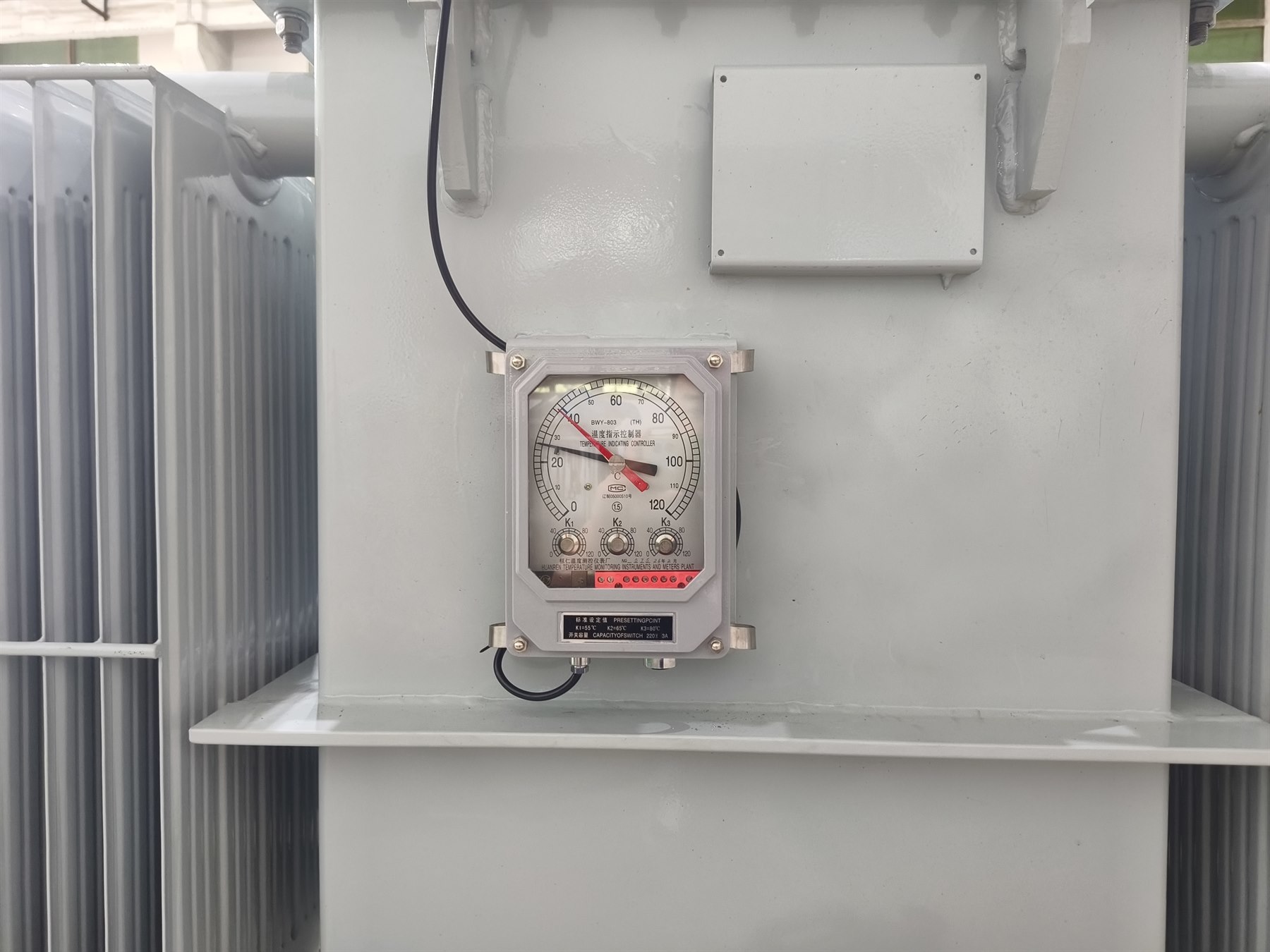 Hermetically sealed transformer tank and monitoring interface detail